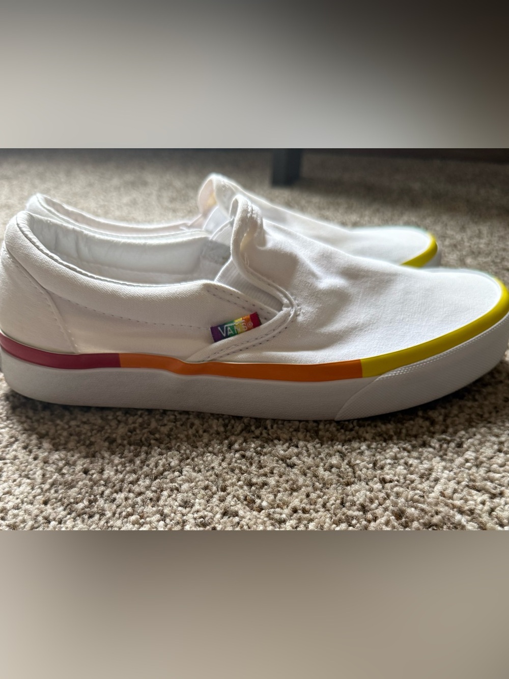 Vans Kids White Slip-On Sneakers with Rainbow Tab and Orange Accent